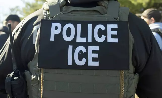 FILE - A U.S. Immigration and Customs Enforcement officer listens during a briefing, Jan. 27, 2025, in Silver Spring, Md. (AP Photo/Alex Brandon, File)