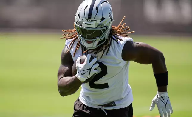 FILE - Las Vegas Raiders running back Ashton Jeanty participates during an NFL football practice Wednesday, June 4, 2025, in Henderson, Nev. (AP Photo/John Locher, File)