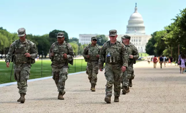 National Guardsmen patrol near the U.S. Capitol, Friday, Aug. 22, 2025, in Washington. (AP Photo/Rahmat Gul)