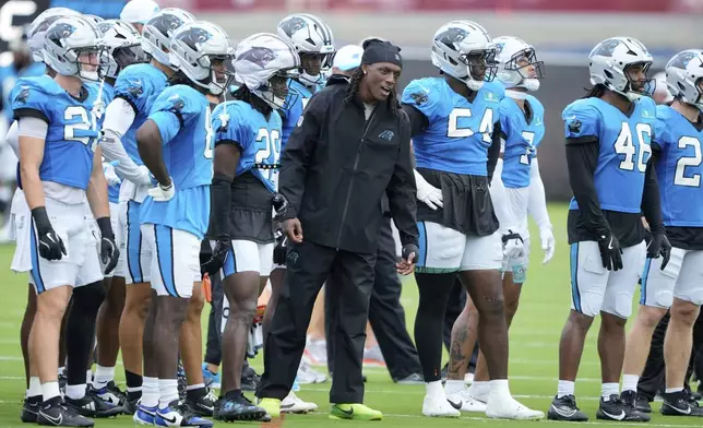 Carolina Panthers cornerback Jaycee Horn watches during an NFL football dual training camp with the Cleveland Browns Wednesday, Aug. 6, 2025, in Charlotte, N.C. Horn was involved in a car accident on his was to camp. (AP Photo/Chris Carlson)