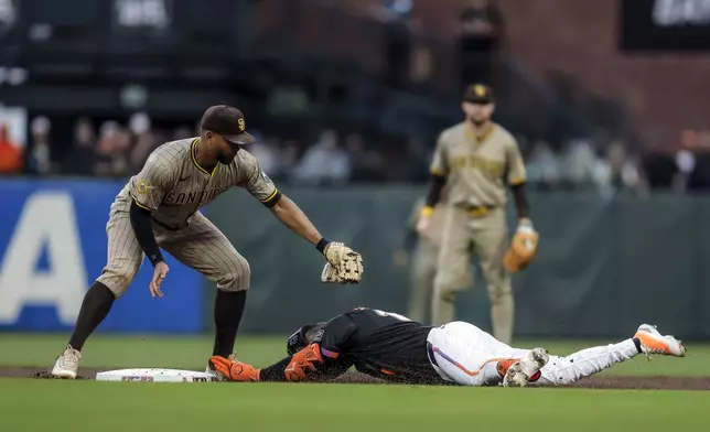 Casey Scmitt (10) safe at second on a double in the first inning as the San Francisco Giants played the San Diego Padres at Oracle Park in San Francisco, on Tuesday, Aug. 12, 2025.(Carlos Avila Gonzalez/San Francisco Chronicle via AP)