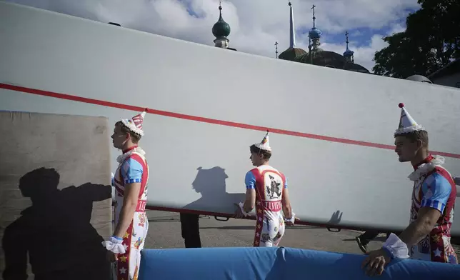Circus performers take part in Karandash-Fest, a street festival of ciscus performers in Staritsa, Tver region, Russia, Saturday, Aug. 2, 2025. (AP Photo/Pavel Bednyakov)