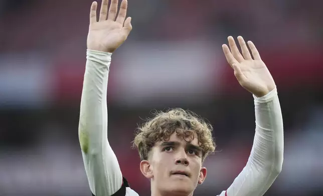 Arsenal's Max Dowman gestures to the fans after the English Premier League soccer match between Arsenal and Leeds United at Emirates stadium in London, England, Saturday, Aug. 23, 2025. (John Walton/PA via AP)