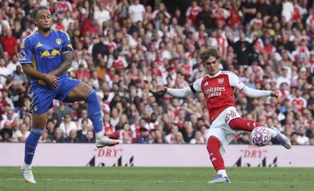 Leeds United's Noah Okafor tries to block a shot from Arsenal's Max Dowman during the English Premier League soccer match between Arsenal and Leeds United at Emirates stadium in London, England, Saturday, Aug. 23, 2025. (AP Photo/Ian Walton)