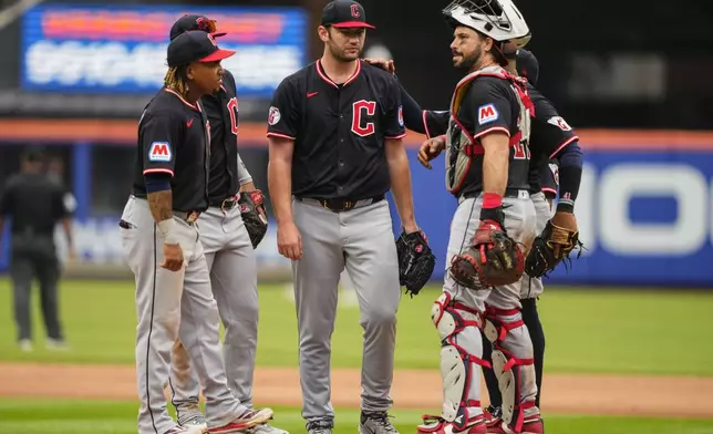 Cleveland Guardians pitcher Gavin Williams (32) is taken out during the ninth inning of a baseball game against the New York Mets, Wednesday, Aug. 6, 2025, in New York. (AP Photo/Yuki Iwamura)