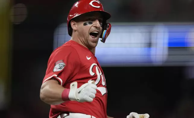 Cincinnati Reds Spencer Steer reacts as he rounds the bases after hitting a three-run homer during the eighth inning of a baseball game against the Atlanta Braves, Thursday, July 31, 2025, in Cincinnati. (AP Photo/Carolyn Kaster)