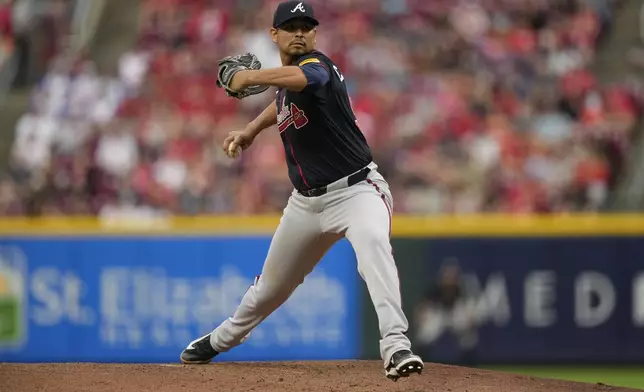 Atlanta Braves' Carlos Carrasco throws during the first inning of a baseball game against the Cincinnati Reds, Thursday, July 31, 2025, in Cincinnati. (AP Photo/Carolyn Kaster)