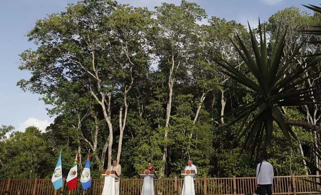 Guatemalan President Bernardo Arévalo, from left, Mexican President Claudia Sheinbaum and Belize Prime Minister Minister Johnny Briceño hold a joint press conference in Calakmul, Campeche state, Mexico, Friday, Aug. 15, 2025. (AP Photo/Martin Zetina)