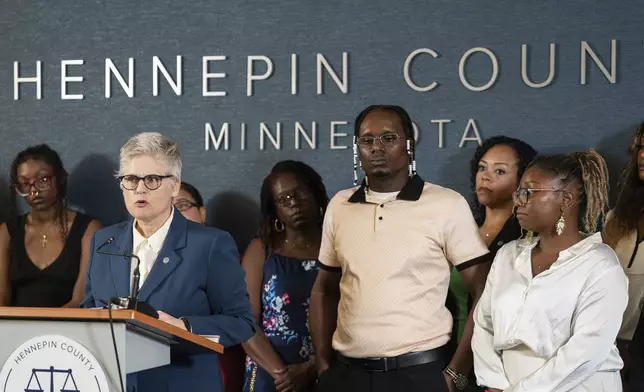 Hennepin County Attorney Mary Moriarty announces that Bryan Hooper Sr. would be freed after 27 years, after another prisoner confessed to the the murder, in Minneapolis, Minn., on Tuesday, Aug. 12, 2025. Bryan's daughter, Briana Hooper, is at right. (Richard Tsong-Taatarii/Star Tribune via AP)