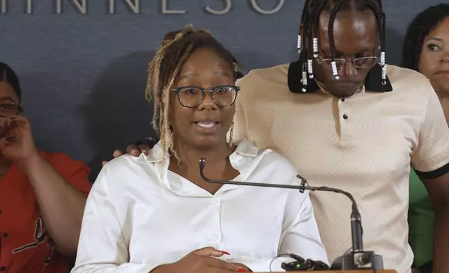 Briana Hooper talks to reporters about her father Bryan Hooper Sr.'s conviction for a murder that prosecutors now say he did not commit on Tuesday, Aug. 12, 2025 in Minneapolis, Minn. (AP Photo/Mark Vancleave)