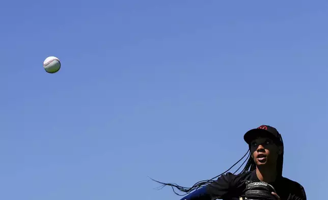 Mo'ne Davis watches the ball during an outfielder drill at the first day of tryouts for the Women's Professional Baseball League, Friday, Aug. 22, 2025, at the Washington Nationals Youth Baseball Academy in Washington. (AP Photo/Julia Demaree Nikhinson)