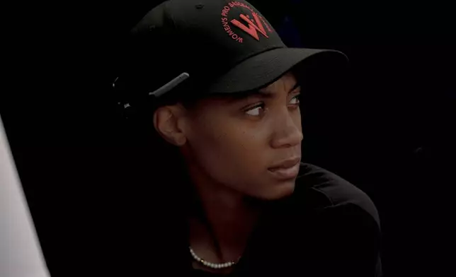 Mo'ne Davis watches a scrimmage from the dugout during the third day of tryouts for the Women's Professional Baseball League, Sunday, Aug. 24, 2025, at the Washington Nationals Youth Baseball Academy in Washington. (AP Photo/Julia Demaree Nikhinson)