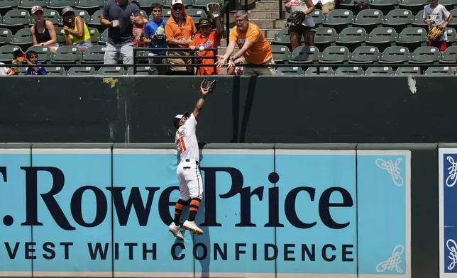 Baltimore Orioles center fielder Cedric Mullins (31) catches a fly ball hit by Toronto Blue Jays' Ali Sanchez for the out during the sixth inning of a baseball game, Wednesday, July 30, 2025, in Baltimore. (AP Photo/Stephanie Scarbrough)
