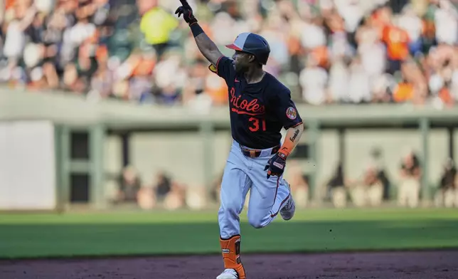 Baltimore Orioles' Cedric Mullins rounds the bases after hitting a two-run home run during the second inning of a baseball game against the Toronto Blue Jays, Monday, July 28, 2025, in Baltimore. (AP Photo/Stephanie Scarbrough)