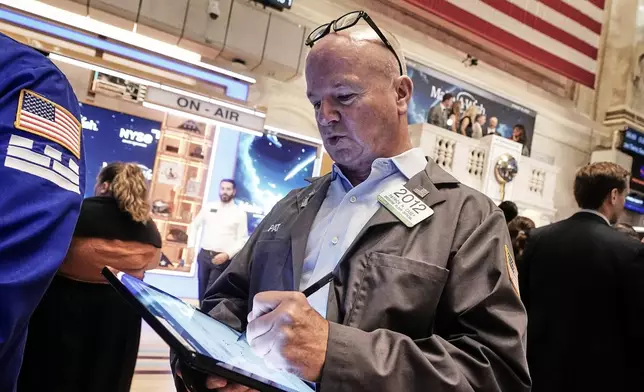 Trader Patrick Casey works on the floor of the New York Stock Exchange, Monday, Aug. 18, 2025. (AP Photo/Richard Drew)