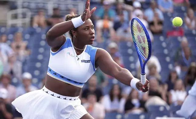 Taylor Townsend, of the United States, returns a shot during her doubles match with her partner, with Katerina Siniakova, of the Czech Republic, against Aldila Sutjiadi, of Indonesia, and Nadiia Kichenok, of Ukraine, in the second round of the U.S. Open tennis championships, Thursday, Aug. 28, 2025, in New York. (AP Photo/Frank Franklin II)