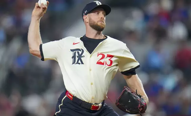 Texas Rangers pitcher Merrill Kelly throws a pitch to the Philadelphia Phillies during the first inning of a baseball game Friday, Aug. 8, 2025, in Arlington, Texas. (AP Photo/Julio Cortez)