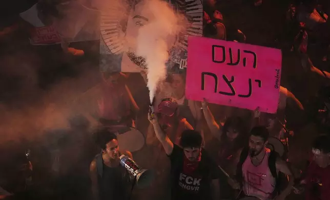 Relatives and supporters of Israeli hostages held in the Gaza Strip Participate a demonstration demanding their release from Hamas captivity and calling for an end to the war, in Tel Aviv, Israel, Thursday, Aug. 7, 2025. (AP Photo/Ariel Schalit)