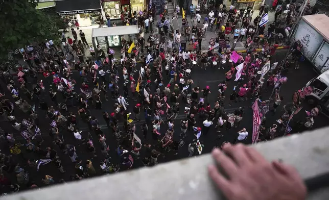 Relatives and supporters of Israeli hostages held in the Gaza Strip Participate a demonstration demanding their release from Hamas captivity and calling for an end to the war, in Tel Aviv, Israel, Thursday, Aug. 7, 2025. (AP Photo/Ariel Schalit)