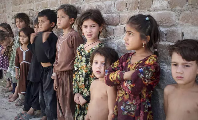 Afghan children wait in line to get a polio vaccine in Jalalabad, Afghanistan, May 26, 2025. (AP Photo/Shafiullah Kakar)