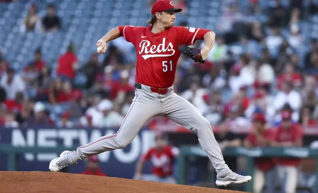 Cincinnati Reds pitcher Brady Singer throws to a Los Angeles Angels batter during the first inning of a baseball game, Monday, Aug. 18, 2025, in Anaheim, Calif. (AP Photo/Jessie Alcheh)