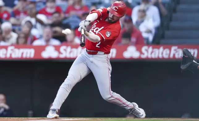 Cincinnati Reds designated hitter Gavin Lux hits a home run during the first inning of a baseball game against the Los Angeles Angels, Monday, Aug. 18, 2025, in Anaheim, Calif. (AP Photo/Jessie Alcheh)