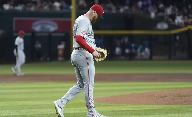 Cincinnati Reds starting pitcher Zack Littell pauses on the field after giving up a three-run home run to Arizona Diamondbacks' Gabriel Moreno during the third inning of a baseball game Friday, Aug. 22, 2025, in Phoenix. (AP Photo/Ross D. Franklin)