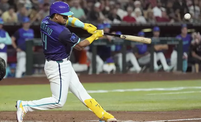 Arizona Diamondbacks' Gabriel Moreno connects for a three-run home run against the Cincinnati Reds during the third inning of a baseball game Friday, Aug. 22, 2025, in Phoenix. (AP Photo/Ross D. Franklin)