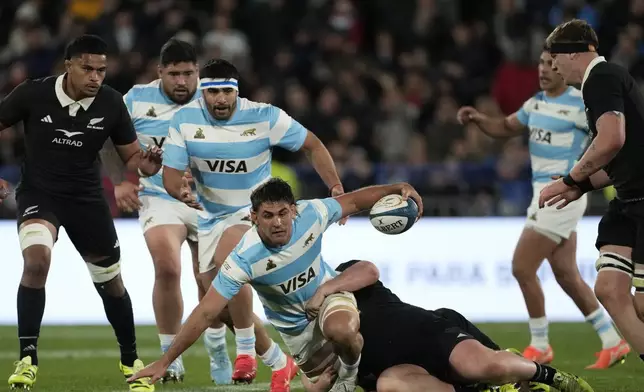 Argentina's Los Pumas Pablo Matera is tackled by New Zealand's All Blacks Fletcher Newell during a rugby championship match in Buenos Aires, Argentina, Saturday, Aug. 23, 2025. (AP Photo/Gustavo Garello)