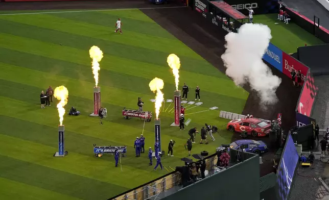 Players are introduced before the MLB Speedway Classic baseball game between the Atlanta Braves and the Cincinnati Reds at Bristol Motor Speedway in Bristol, Tenn., Saturday, Aug. 2, 2025. (AP Photo/George Walker IV)