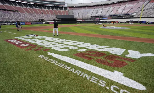 Members of the grounds crew prepare the field prior to the MLB Speedway Classic baseball game at Bristol Motor Speedway in Bristol, Tenn., Saturday, Aug. 2, 2025. (AP Photo/George Walker IV)