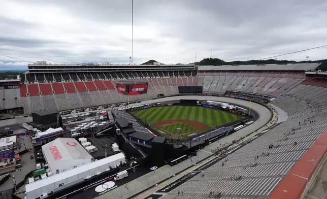 Members of the grounds crew prepare the field prior to the MLB Speedway Classic baseball game at Bristol Motor Speedway in Bristol, Tenn., Saturday, Aug. 2, 2025. (AP Photo/George Walker IV)