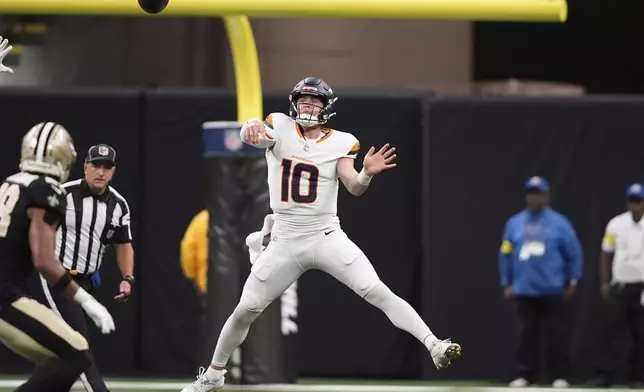 Denver Broncos quarterback Bo Nix passes the ball against the New Orleans Saints in the first half of an NFL preseason football game Saturday, Aug. 23, 2025, in New Orleans. (AP Photo/Gerald Herbert)