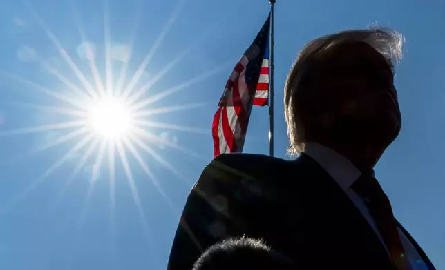 President Donald Trump speaks with reporters before departing on Marine One from the South Lawn of the White House, Friday, July 25, 2025, in Washington. The President is traveling to Scotland. (AP Photo/Alex Brandon)