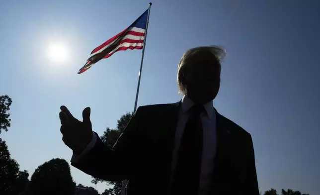 President Donald Trump speaks with reporters before departing on Marine One from the South Lawn of the White House, Friday, July 25, 2025, in Washington. The President is traveling to Scotland. (AP Photo/Alex Brandon)