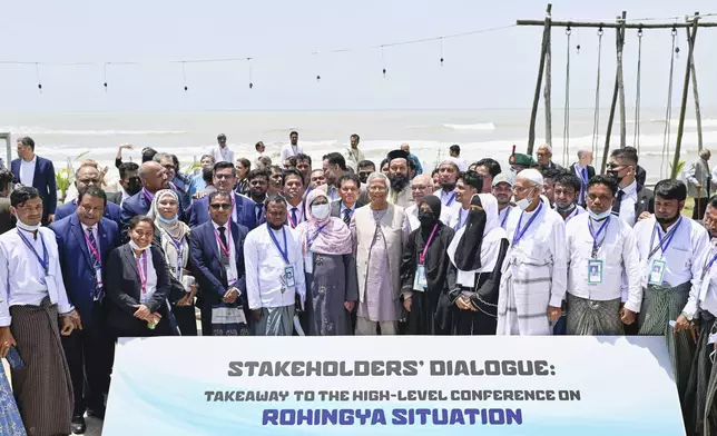 Chief Adviser Professor Muhammad Yunus, a Nobel Peace Prize laureate, middle, attends a stakeholders' dialogue on the Rohingya situation in Cox's Bazar, Bangladesh, on Monday, Aug. 25, 2025. (AP Photo/Mahmud Hossain Opu)