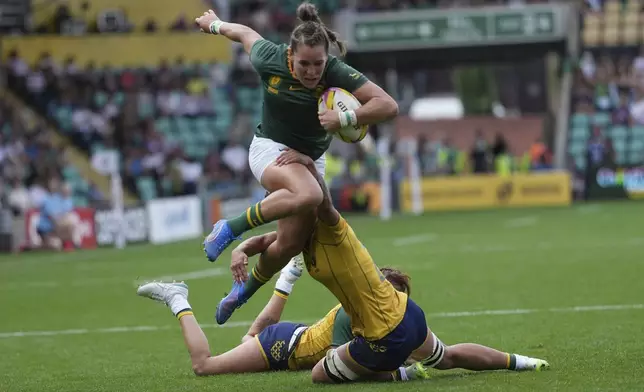 South Africa's Jacomina Cilliers is tackled during the group D match at the 2025 Women's Rugby World Cup between South Africa and Brazil in Northampton, England, Sunday, Aug. 24, 2025. (AP Photo/Dave Shopland)