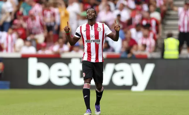 Brentford's Dango Ouattara celebrates scoring their side's first goal of the game during the English Premier League soccer match between Brentford and Aston Villa at the Gtech Community Stadium in London, Saturday, Aug. 23, 2025. (Nigel French/PA via AP)