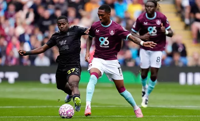 Burnley's Jaidon Anthony, center, and Sunderland's Noah Sadiki, left, battle for the ball during their English Premier League soccer match at Turf Moor, Burnley, England, Saturday, Aug. 23, 2025. (Nick Potts/PA via AP)