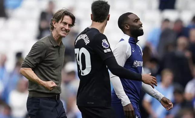 Tottenham's head coach Thomas Frank reacts after the Premier League soccer match between Manchester City and Tottenham in Manchester, England, Saturday, Aug. 23, 2025. (AP Photo/Dave Thompson)