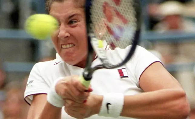 FILE - Monica Seles returns the ball to Conchita Martinez of Spain during the semifinals at the U.S. Open, Sept. 8, 1995 in New York. (AP Photo/Elise Amendola, file)
