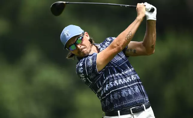 Rickie Fowler hits from the seventh tee during the first round of the BMW Championship golf tournament Thursday, Aug. 14, 2025, in Owings Mills, Md. (AP Photo/Nick Wass)