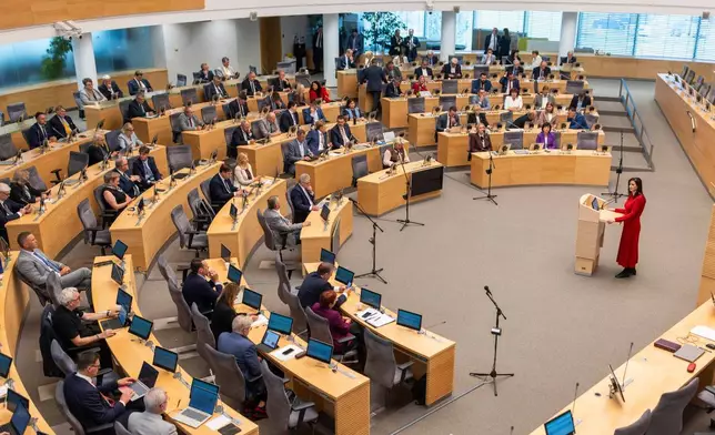 Lithuania's Social Democratic party member Inga Ruginiene, nominated as the next Prime Minister, speaks during a Lithuania's parliament session in Vilnius, Lithuania, Tuesday, Aug. 26, 2025. (AP Photo/Mindaugas Kulbis)