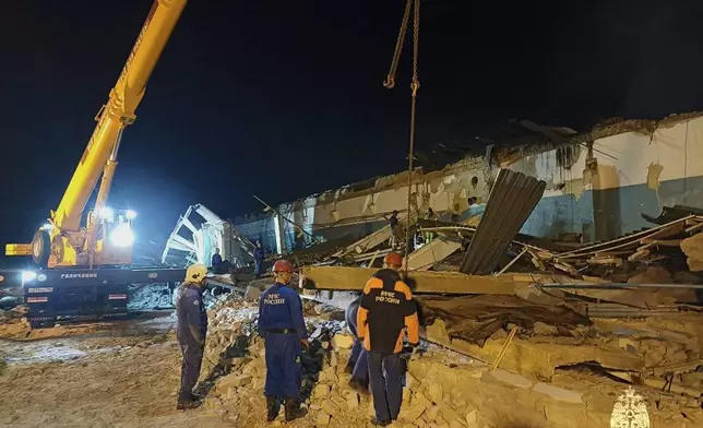 In this photo, released by the Russian Emergency Ministry Press Service on Saturday, Aug. 16, 2025, Emergency Ministry employees work in debris of an industrial plant after a fire at the facility in the Shilovsky District, Ryazan region, around 250 kilometers (155 miles) southeast of Moscow, Russia. (Russian Emergency Ministry Press Service via AP)