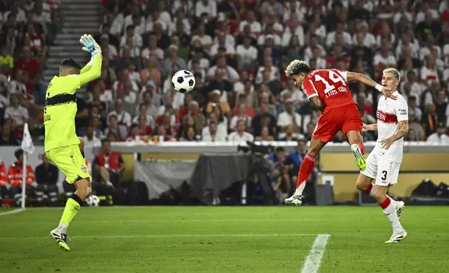Bayern's Luis Díaz, center, celebrates scores past Stuttgart's goalkeeper Fabian Bredlow the German Supercup final soccer match between VfB Stuttgart and Bayern Munich in Stuttgart, Germany, Saturday, Aug. 16, 2025. (Tom Weller/dpa via AP)