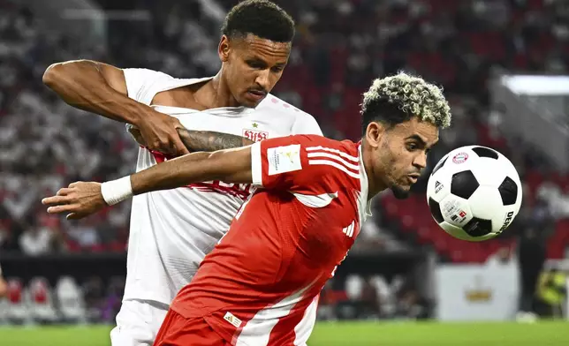 Bayern's Luis Diaz, right, and Stuttgart's Luca Jaquez challenge for the ball during the German Super Cup final soccer match between VfB Stuttgart and Bayern Munich in Stuttgart, Germany, Saturday, Aug. 16, 2025. (Tom Weller/dpa via AP)