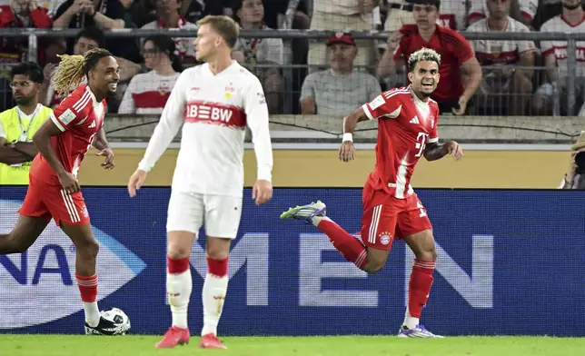 Bayern's Luis Díaz, right, celebrates after scoring a goal during the German Supercup final soccer match between VfB Stuttgart and Bayern Munich in Stuttgart, Germany, Saturday, Aug. 16, 2025. (Bernd Weissbrod/dpa via AP)