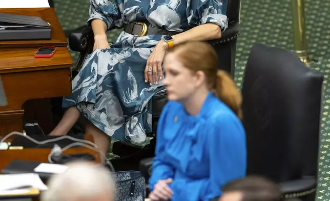 Texas Sen. Carol Alvarado, D-Houston, sits at her desk as senators vote on HB 4 to redrawn U.S. congressional map during a special session in the Senate Chamber at the Texas Capitol in Austin, Texas, Saturday, Aug. 23, 2025. (AP Photo/Stephen Spillman)