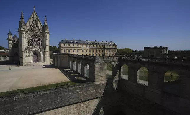 View of the Chateau de Vincennes, a massive fortress with the Holy Chapel, left, just east of Paris, Tuesday, Aug. 12, 2025. (AP Photo/Aurelien Morissard)