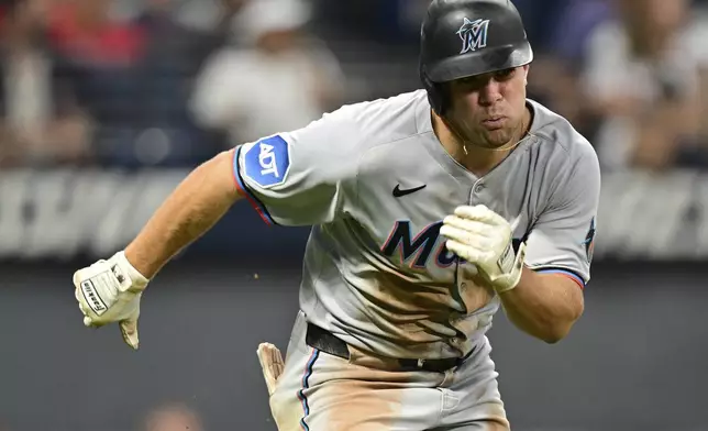 Miami Marlins' Jakob Marsee runs after hitting a two-RBI double during the sixth inning of a baseball game against the Cleveland Guardians, Wednesday, Aug. 13, 2025, in Cleveland. (AP Photo/David Dermer)